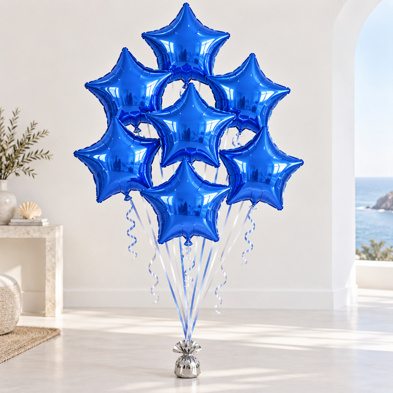 Bouquet of royal-blue star-shaped Mylar balloons with white and powder-blue ribbons