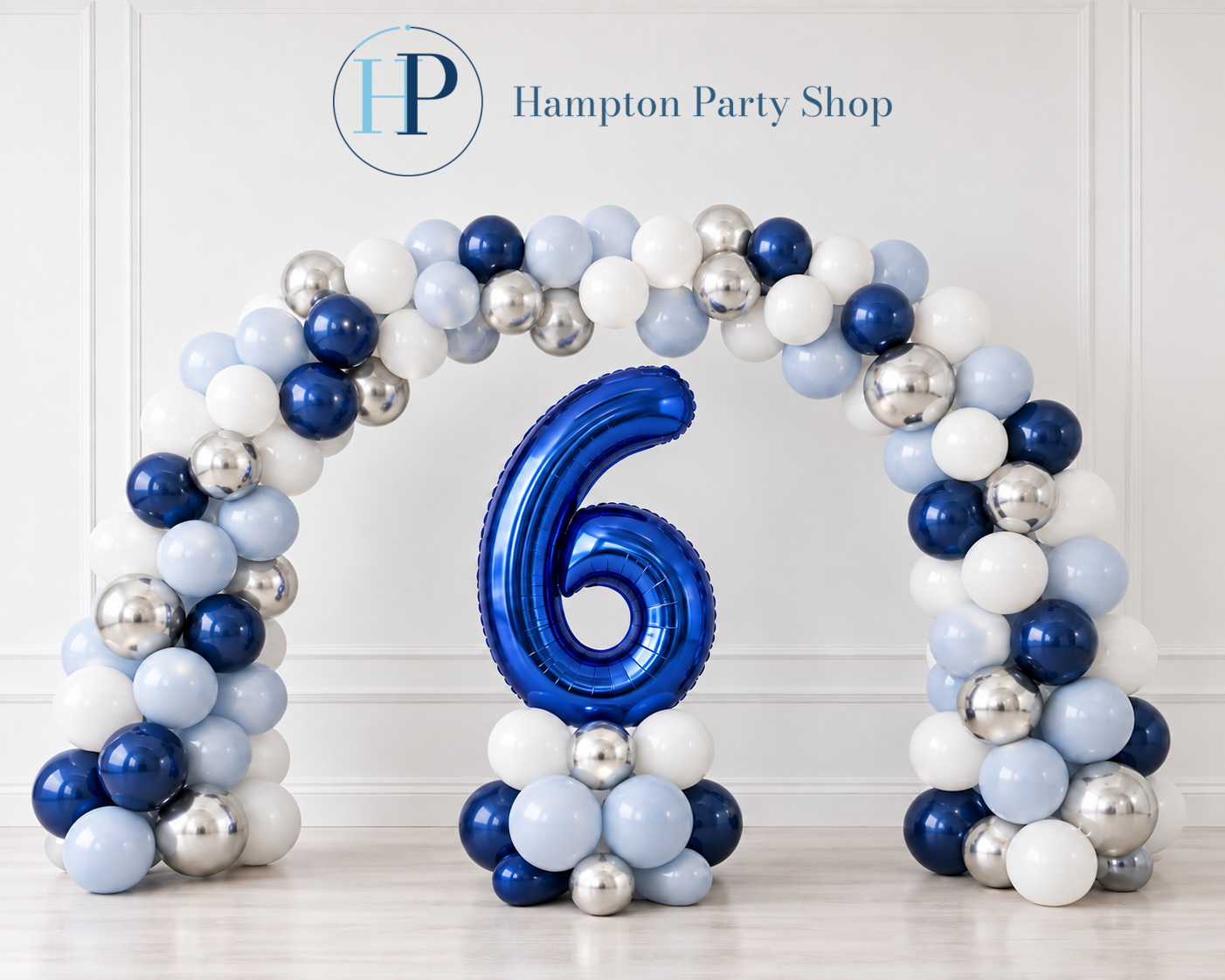 Blue, powder-blue, white and silver balloon arch with a large navy number six