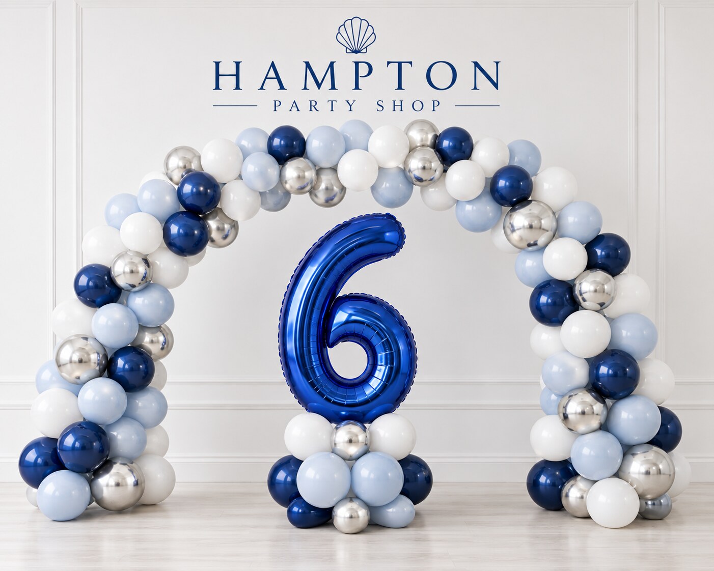 Blue, powder-blue, white and silver balloon arch with a large navy number six