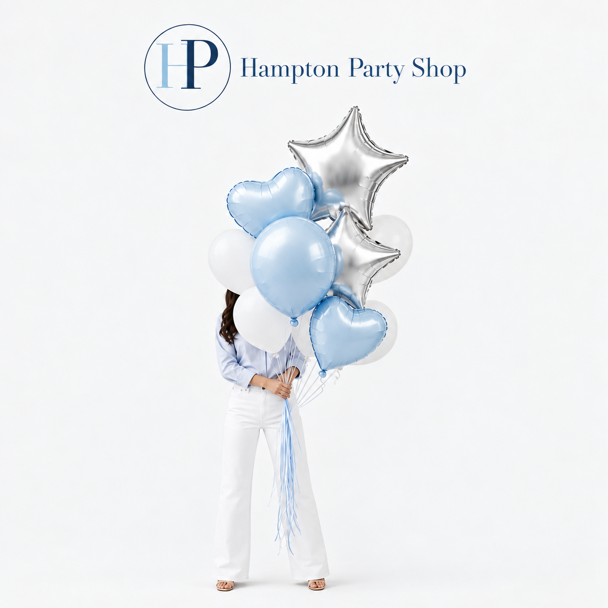 Woman personally delivering a blue, white and silver Hampton Party Shop balloon collection