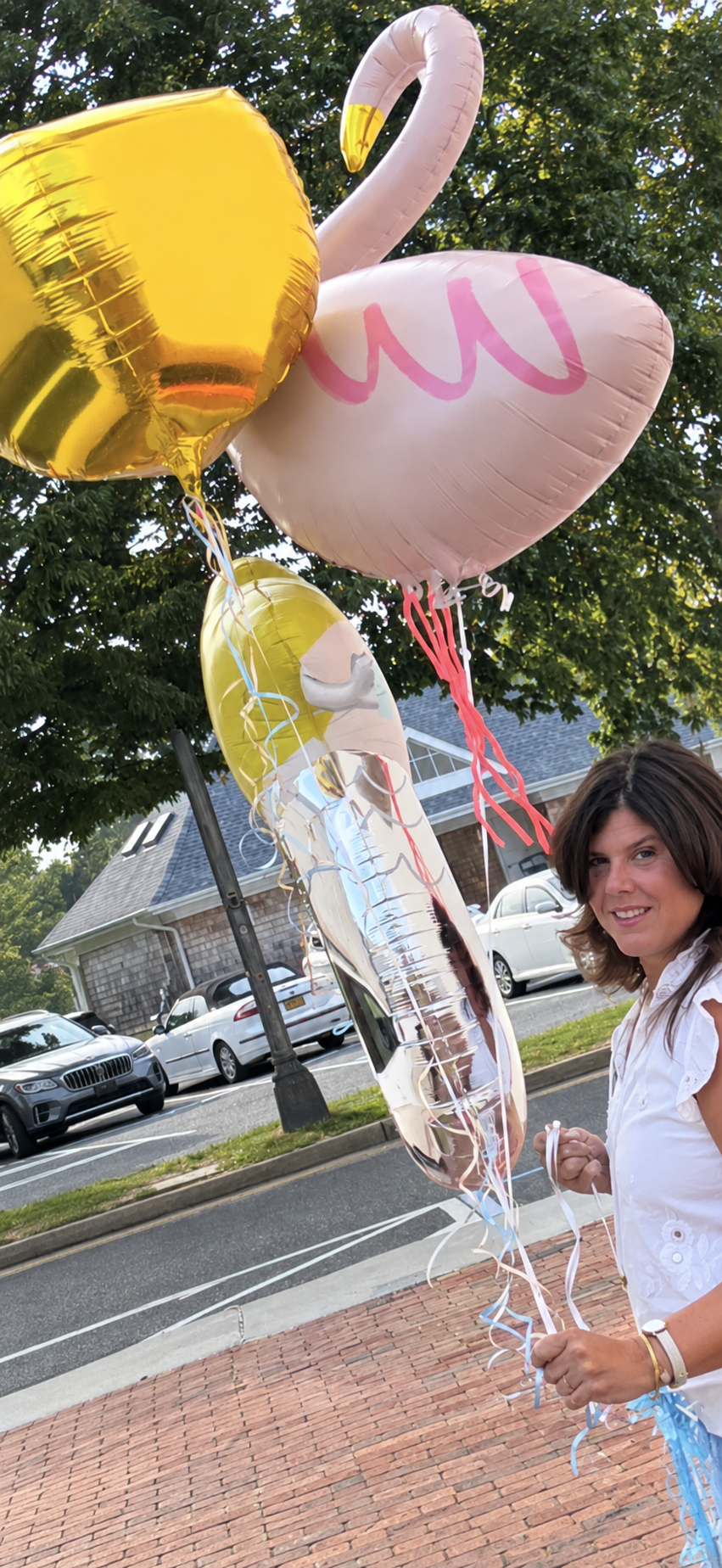 Hampton Party Shop delivering a playful gold, pink and silver balloon arrangement in the village